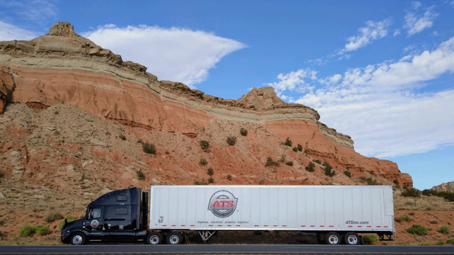 Dry-van-trailer-parked-on-road-shoulder